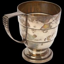 An Art Deco George VI silver christening mug, Walker & Hall, Sheffield 1938, stepped cylindrical