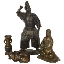 A Chinese bronze temple figure, study of Guyan and moving child, a small bronze 2-handled vase, a