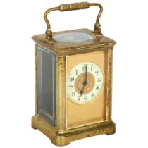 A French brass-cased 8-day carriage clock, with gilded dial, height not including handle 12cm,