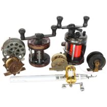 A group of fishing reels, including 2 multipliers, 1 by Neptune and other by Steady Fast, and an
