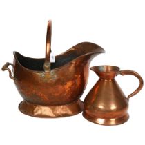 A Victorian copper coal scuttle, with swing handle, and a Victorian copper half gallon measure