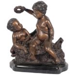 A patinated spelter group of 2 cherubs, on a shaped marble base, H50cm Good overall condition,