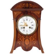 An Art Nouveau mahogany and satinwood inlaid 8-day mantel clock, with enamelled dial, complete