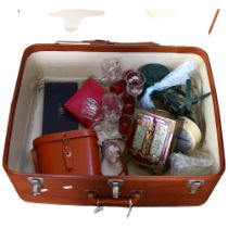 A suitcase containing kitchen scale and weights, clock, binoculars, glassware and a jewellery