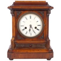 An early 20th century walnut-cased 8-day mantel clock, complete with key and pendulum, 14-day
