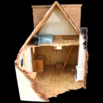 A hand-built model of a partially demolished house, with some furniture and ladder, H70cm