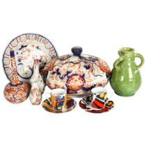 An Imari porcelain tureen and cover, L23cm, vases, pierced plate, and a pair of coffee cans and