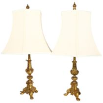 A pair of cast gilt-brass twin light table lamps, with matching shades, H64cm