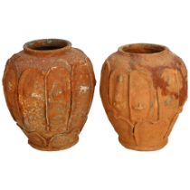 2 similar terracotta vases, with moulded figure panels, 21.5cm