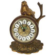 "Marksmen", a brass-cased travelling alarm clock, on a bird and branch stand, H11cm