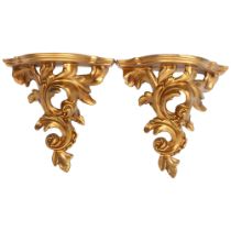 A pair of composition Florentine style wall brackets, W20cm