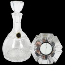 An Orrefors glass table clock, inscribed "Thank you from the leading hotels of the world ltd", and