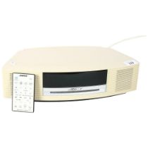 A Bose Wave music system, model AWRCC6, including FM/AM radio, CD, alarm etc, includes remote