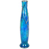 An Art Nouveau style mottled blue glass vase with pewter overlay, indistinct signature, H35.5cm