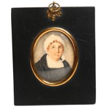 A 19th century oval miniature, watercolour on paper, study of a lady in a bonnet, framed, given as a