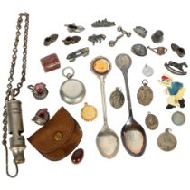 A box of various items, including the Metropolitan patent whistle and chain, various religious fobs,