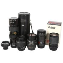 A group of camera lenses, including a Vivitar 28-85mm, F1:3.5-4.5, macro focussing zoom lens, serial