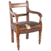 A 19th century mahogany child's elbow chair with studded seat
