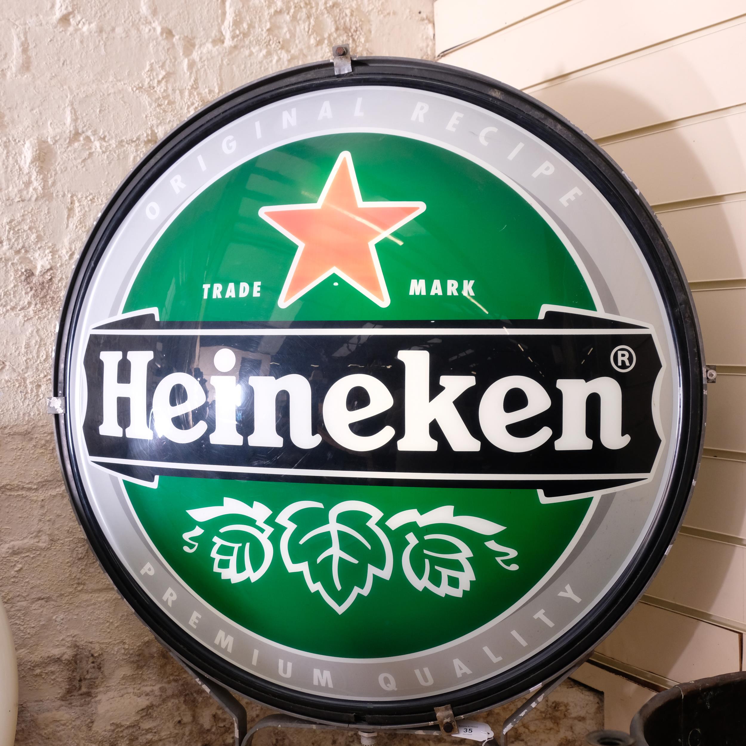 "Heineken", a large double-sided circular illuminated advertising sign for Heineken, on stand, H97cm - Image 2 of 2
