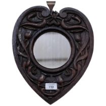 A stylised Arts and Crafts heart-shaped wall mirror, with stylised decoration, L34cm