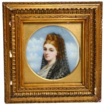 A 19th century circular miniature, watercolour on porcelain panel, portrait study of a young lady