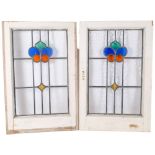A pair of early 20th century coloured leadlight window frames, 70cm x 45cm overall, rebate 55cm x