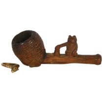 A carved wood Black Forest pipe, surmounted by a bear, and a brass bear design ring (2)