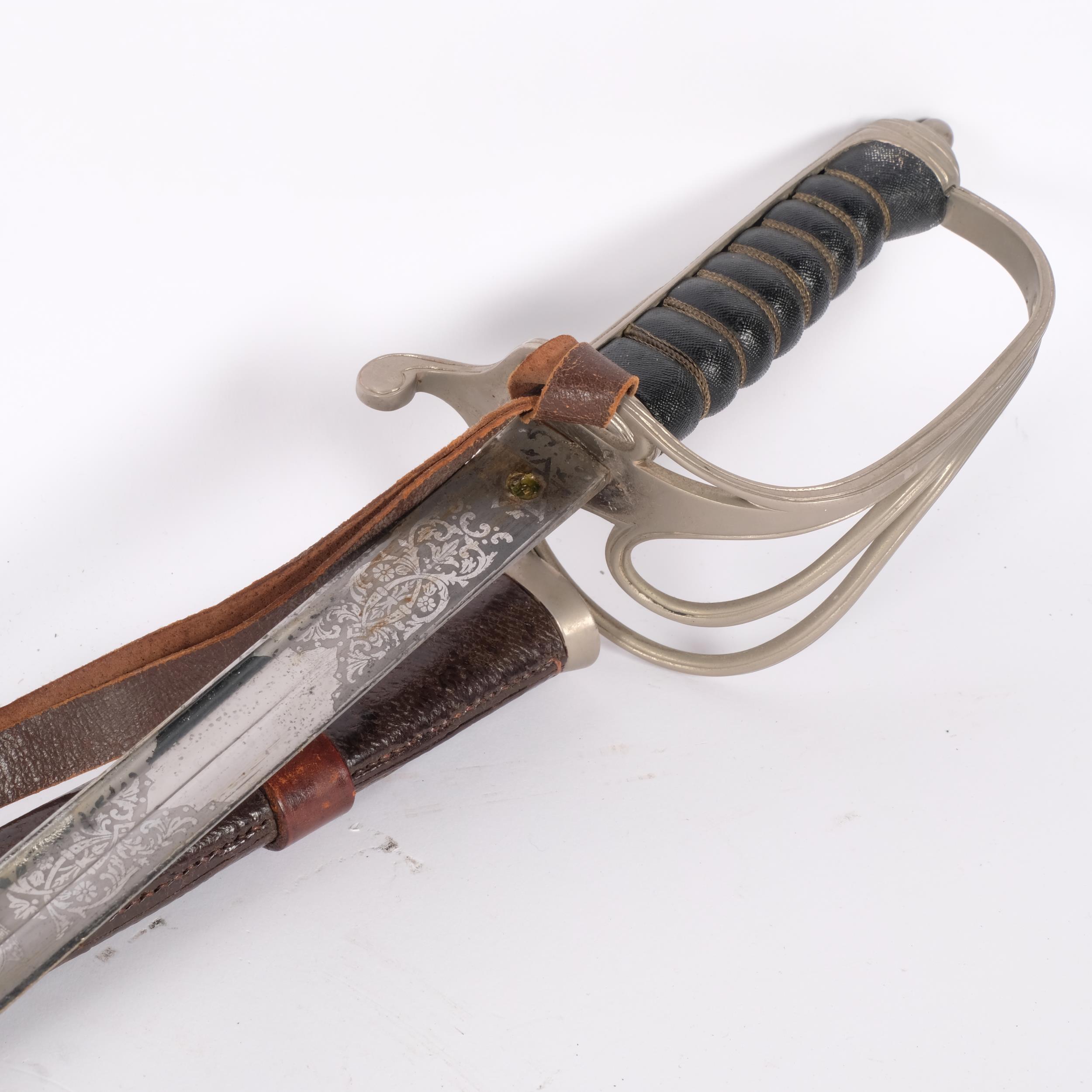 An 1821 pattern Light Cavalry Officer's sword, in leather scabbard, with engraved blade, overall - Image 2 of 2