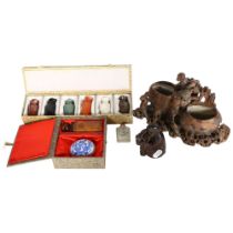 A boxed seal set, a boxed set of 6 stone vases, 2 soapstone carvings, and a miniature internally