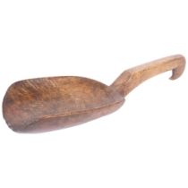 A polished elm peat shovel, with shaped bowl and a hooked handle end, L40cm