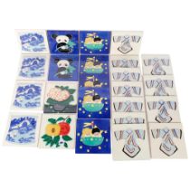 A box of 24 various modern decorative tiles