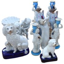 A group of Continental porcelain and ceramic figurines, including various ornamental candlesticks,