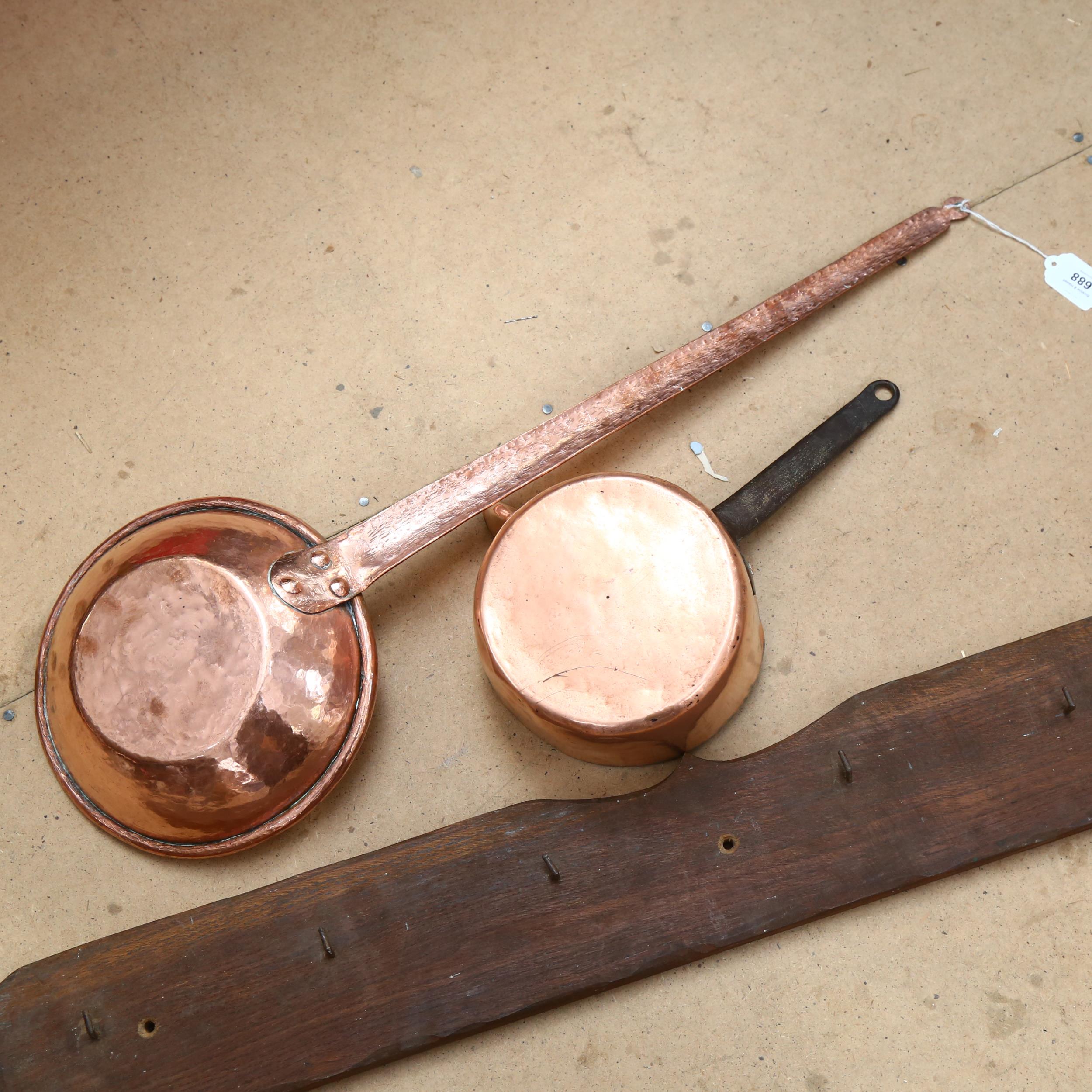 A long-handled copper pan, 77cm, a copper milk pan, and coat hooks - Image 2 of 2