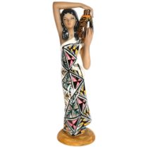 A large Italian painted porcelain figure of a lady with a water container, H71cm