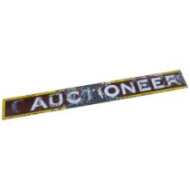An early 20th century brown and yellow enamelled sign "Auctioneer", L215cm, H24cm