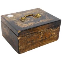 An Oriental lacquered and gilded tea caddy, with brass carrying handle, and fitted metal-lined