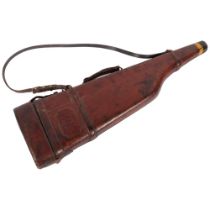 A 19th century brown leather leg-of-mutton shotgun case, complete with shoulder strap and handle,