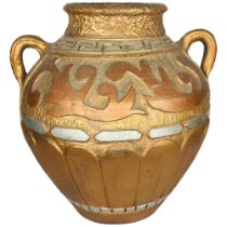 A large gilded 2-handled clay pot, with embossed decoration, H46cm