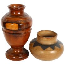 An incised and painted clay vase, and a South American turned hardwood pot, 28cm