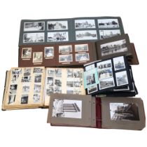 An early 20th century and later family photograph albums, a scrapbook, an atlas etc