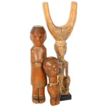 A Onitshwa Province Nigeria Ibo carved figure, and another, and an African carved wood figural