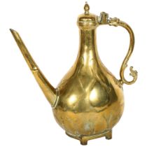 A Middle Eastern brass ewer with integrated stand, H33.5cm