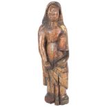An 18th/19th century Italian polychrome wood carving of a lady in a cloak holding a candle, H60cm