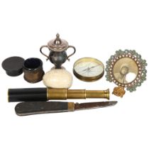 A small silver 2-handled trophy and cover on stand, a small 3-draw telescope, a circular micro-