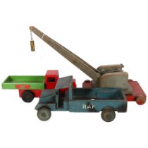 A Chad Valley wooden tipper truck, L30cm, an RAF wooden truck, and a scratch built wooden crane.