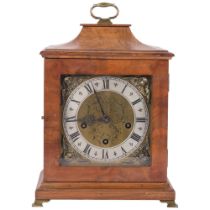 A walnut-cased mantel clock with engraved dial and silver chapter ring, with 8-day gong striking