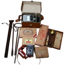 A quantity of various Vintage items, including a hay hook, a Lubitel II camera, a set of Bushel