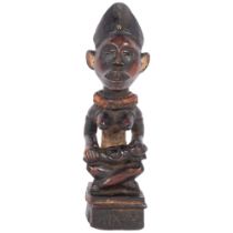 An African Congolese Yombe Tribal carved wood maternity figure, H31cm