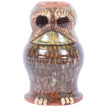 A terracotta glazed flask and cover in the form of an owl, H24cm There is a visible crack through