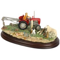 Country Artists sculpture, depicting a tractor driver with Collie and sheep, "securing the field",